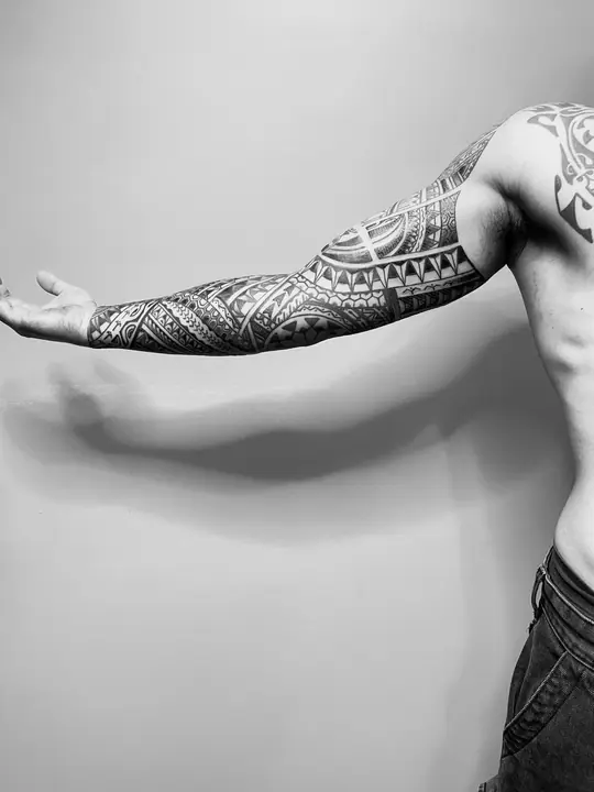 Polynesian tribal tattoo on a full arm sleeve, designed freehand by Leo Martínez at A Sailor's Grave Tattoo, Granollers (Barcelona).