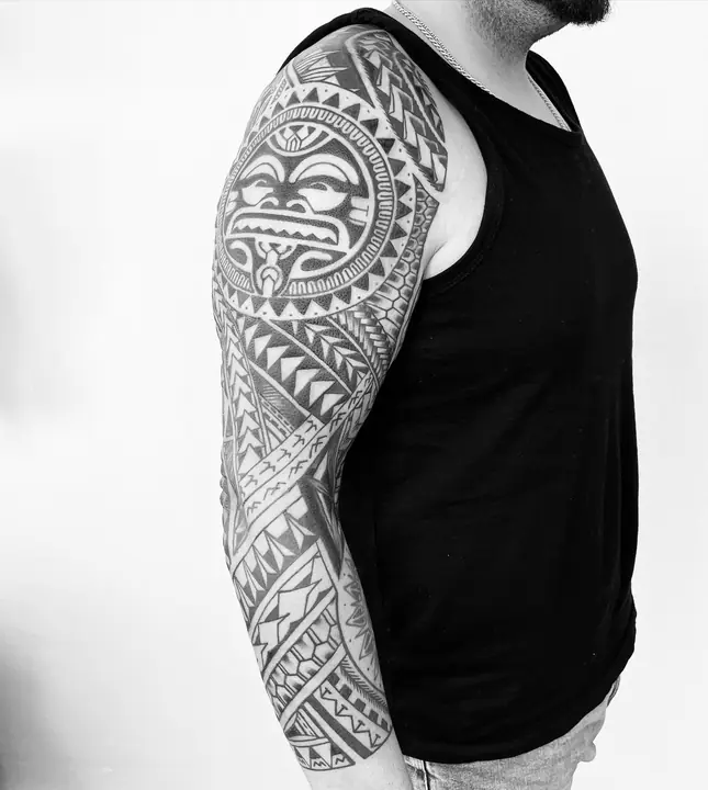 Polynesian tribal tattoo on a full arm sleeve, designed freehand by Leo Martínez at A Sailor's Grave Tattoo, Granollers (Barcelona).